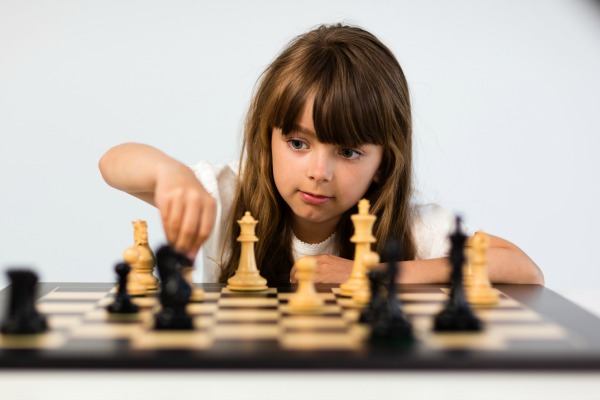 girl playing chess